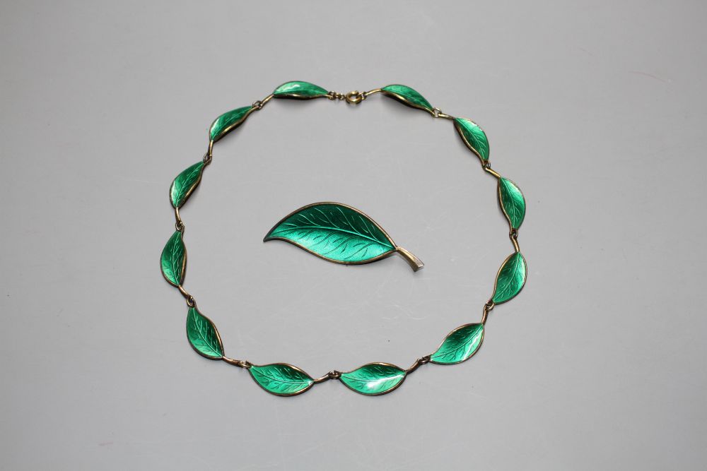 A Norwegian David Andersen 925S and green enamel leaf necklace and one other leaf brooch.